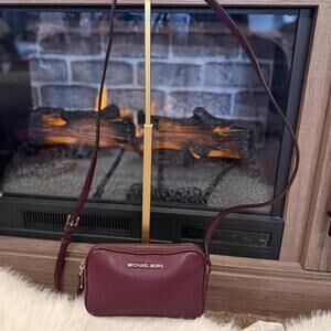 Michael Kors burgundy camera bag crossbody. Perfect for night out